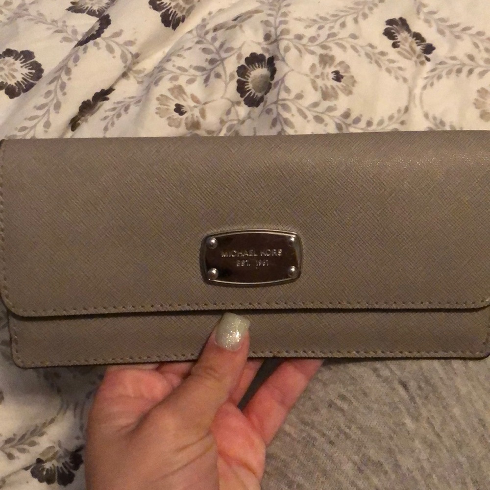 MK wallet ( very small stain)